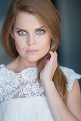 Image showing Close Up of Woman Wearing White Lacy Top