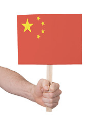 Image showing Hand holding small card - Flag of China