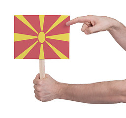 Image showing Hand holding small card - Flag of Macedonia