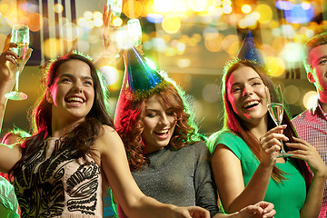 Image showing happy friends with glasses of champagne in club