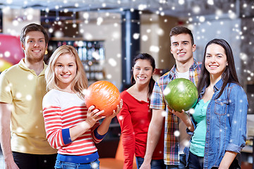 Image showing happy friends in bowling club at winter season