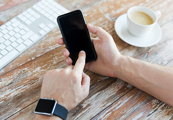 Image showing close up of hands with smart phone and watch