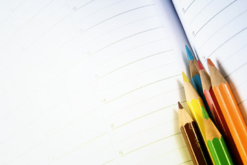 Image showing Color pencil and agenda