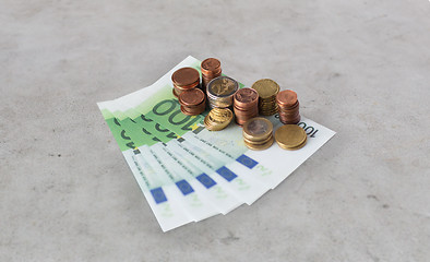 Image showing close up of euro paper money and coins on table