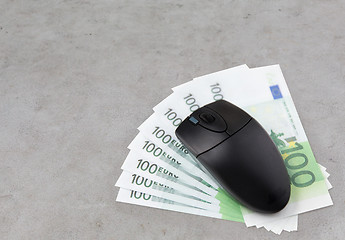 Image showing close up of computer mouse and euro cash money