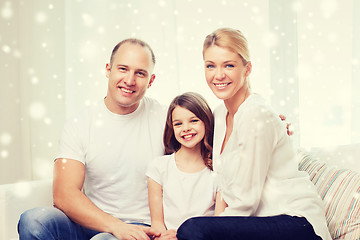 Image showing smiling parents and little girl at home