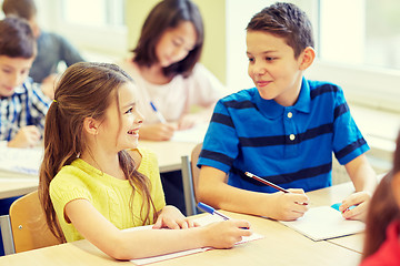 Image showing group of school kids writing test in classroom