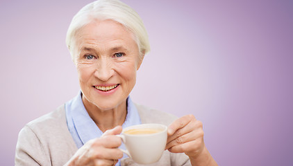 Image showing happy senior woman with cup of coffee