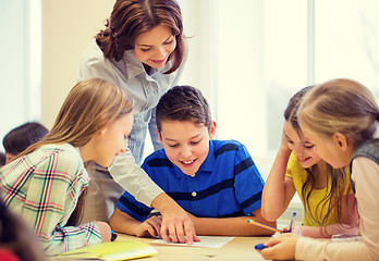 Image showing group of school kids writing test in classroom