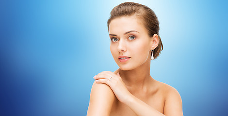 Image showing beautiful woman with diamond earrings and bracelet