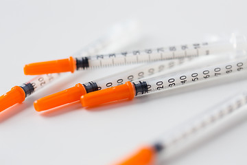 Image showing close up of insulin syringes on table