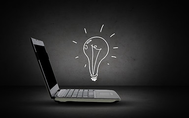 Image showing open laptop computer with lighting bulb doodle