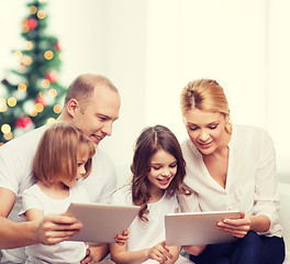 Image showing happy family with tablet pc computers