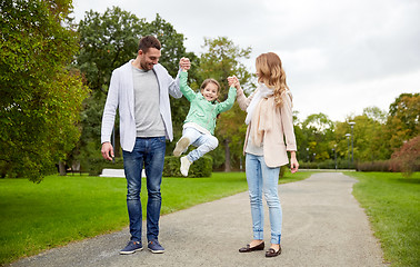 Image showing happy family walking in summer park and having fun