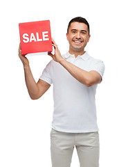 Image showing smiling man with red sale sigh