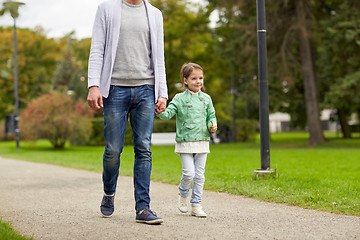 Image showing happy family walking in summer park