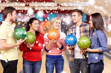 Image showing happy friends in bowling club at winter season