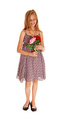 Image showing Lovely girl holding her two roses.