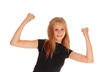 Image showing Happy young girl raising her arms.