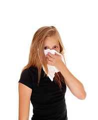 Image showing Little girl blowing her nose.