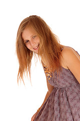 Image showing Smiling little girl bending down.