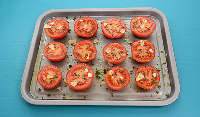 Image showing Tomatoes on a baking tray ready for roasting