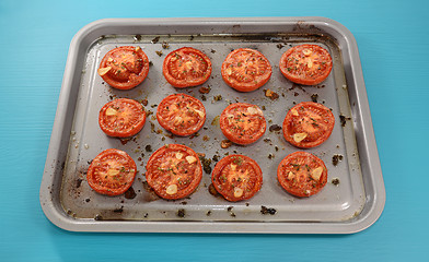 Image showing Tray of roast tomato halves