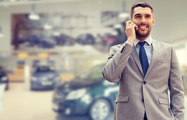 Image showing smiling businessman talking on smartphone