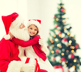 Image showing smiling little girl with santa claus