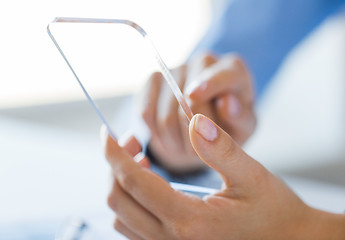 Image showing close up of woman with transparent smartphone