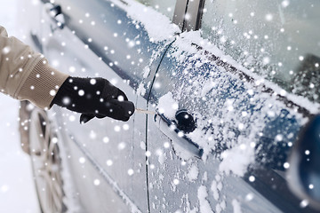 Image showing close up of man with car key outdoors