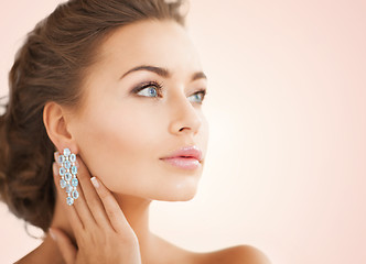 Image showing woman wearing shiny diamond earrings