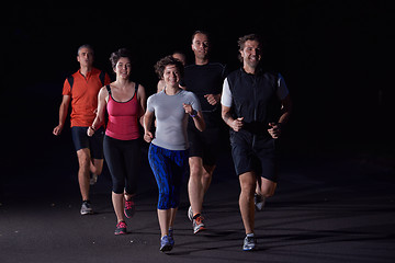 Image showing people group jogging at night