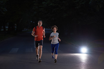 Image showing couple jogging at early morning