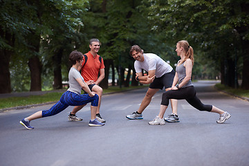 Image showing jogging people group stretching