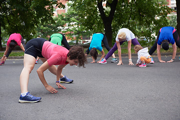 Image showing jogging people group stretching