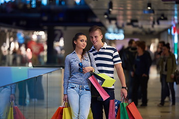 Image showing young couple with shipping bags