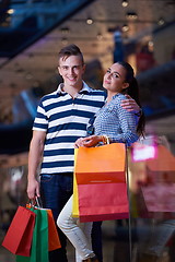 Image showing young couple with shipping bags