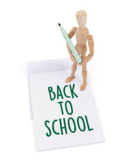 Image showing Wooden mannequin writing - Back to school