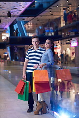 Image showing young couple with shipping bags