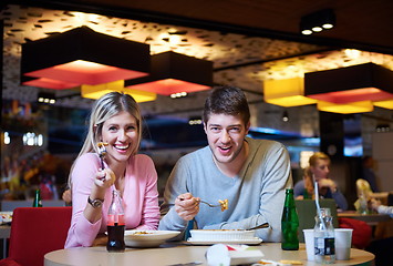 Image showing couple having lunch break in shopping mall