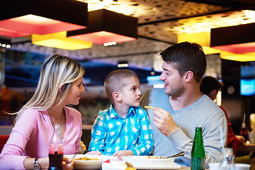 Image showing family having lunch in shopping mall