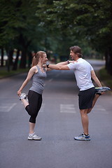 Image showing jogging couple stretching