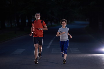 Image showing couple jogging at early morning