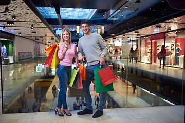 Image showing young couple with shipping bags