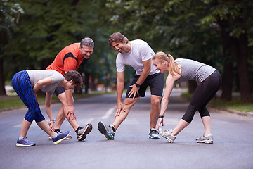 Image showing jogging people group stretching