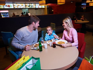 Image showing family having lunch in shopping mall