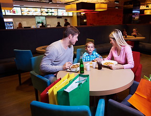 Image showing family having lunch in shopping mall