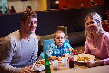 Image showing family having lunch in shopping mall