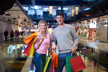 Image showing young couple with shipping bags